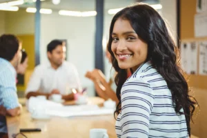 Asian Woman Thinking about Working Desk